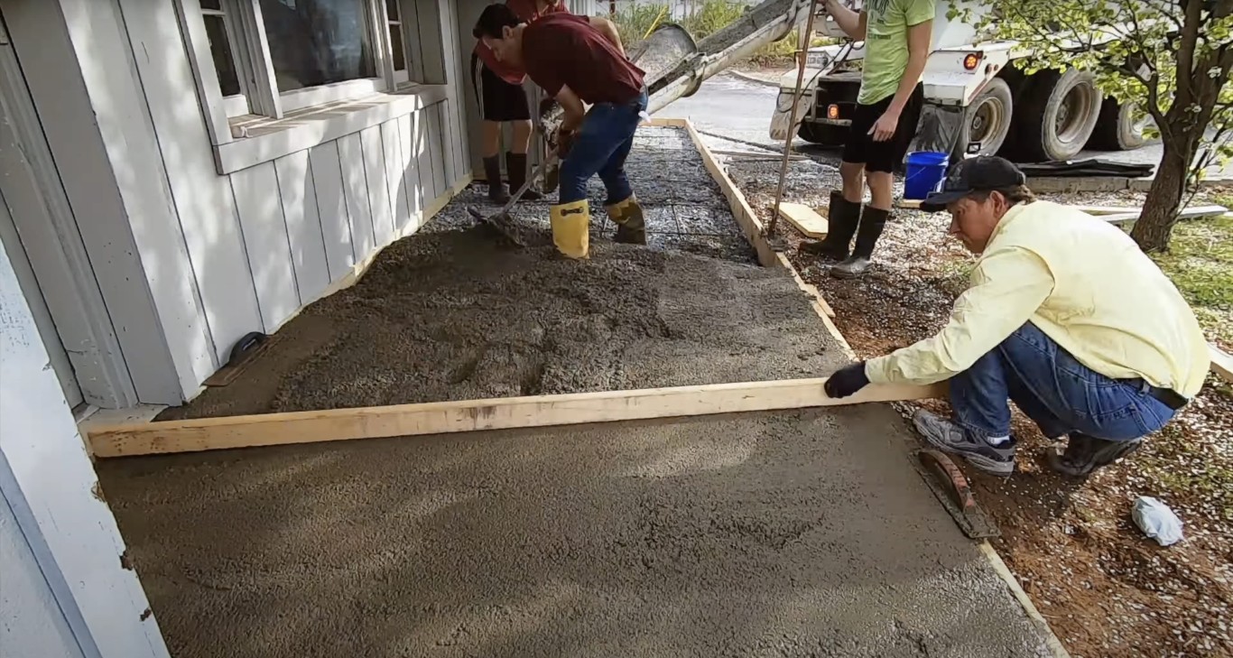 Professional concrete crew pouring foundation slab in Taunton, MA
